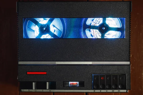 reel to reel audio tape recorder with blue led light strip. VU meter with \