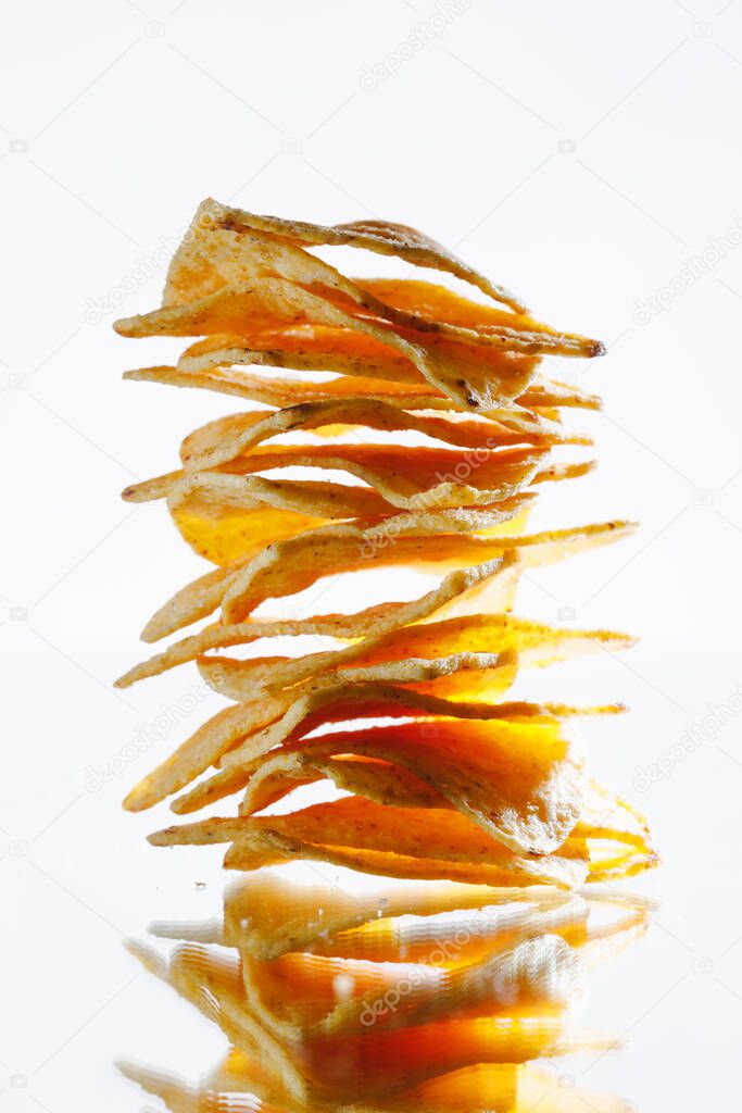 mexican nachos tortilla chips stack on white background