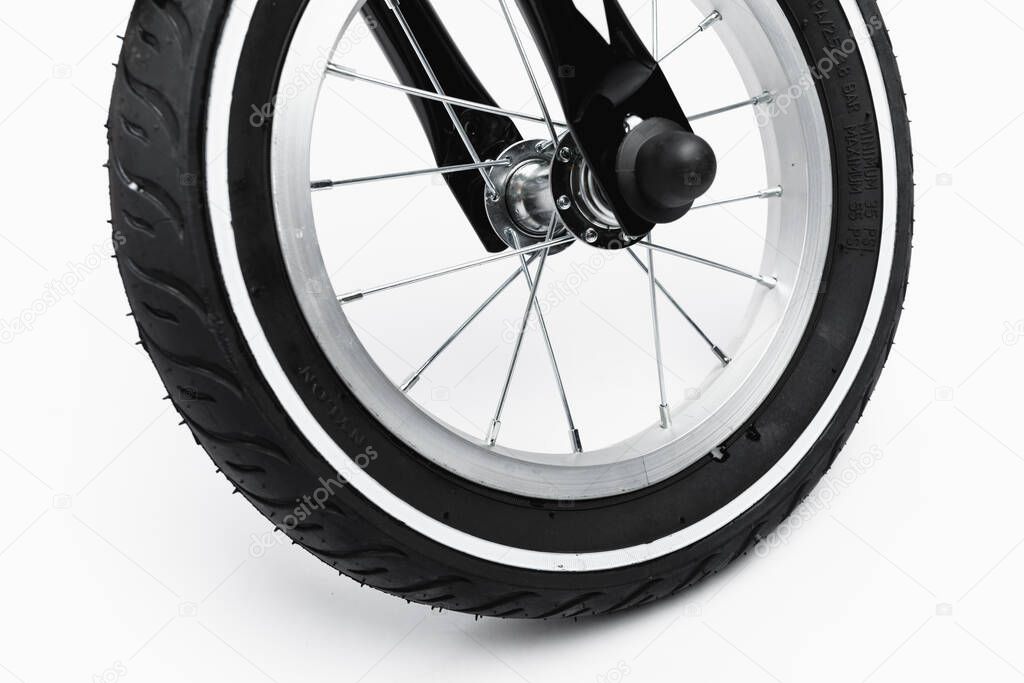part of kids bicycle wheel with spokes, white background