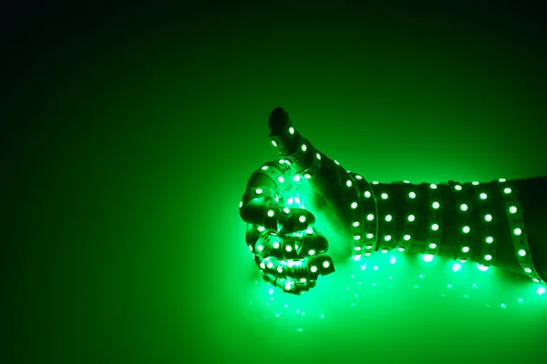 Великі Пальці Вгору Рука Покрита Зеленими Світлодіодними Ліхтарями Освітлений Фон — стокове фото