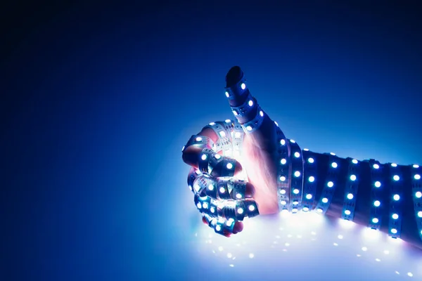 Великі Пальці Вгору Рука Покрита Синіми Світлодіодними Ліхтарями Освітлений Фон — стокове фото