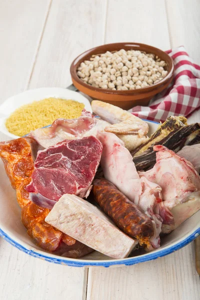 Spanish cocido is a stew with assortment of meat from different animals and chikpeas — Stock Image Spanish Cocido Stew Assortment Meat Different Animals Chikpeas Stock Picture