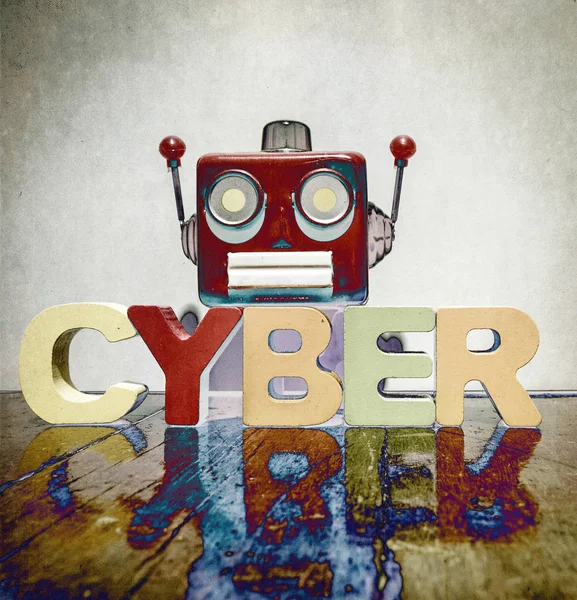 red retro robot head on the word   CYBER on old wooden flor