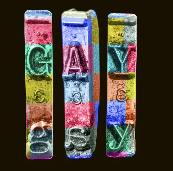 The word GAY   with old typewriter hammers  in rainbow color — Stock Photo, Image