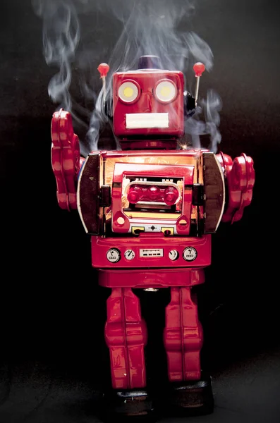 mad  red robot on fire with smoke