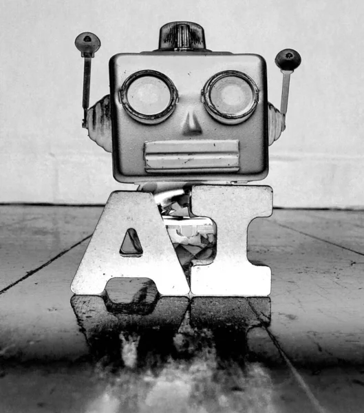 Silver robot head and the letters AI — Stock Photo, Image