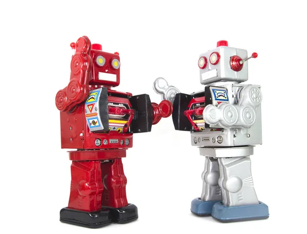 Twee retro robots high five elkaar geïsoleerd — Stockfoto