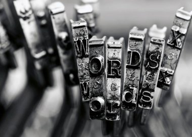 the words WORDS with old typewriter keys  macro  monochrome image clipart