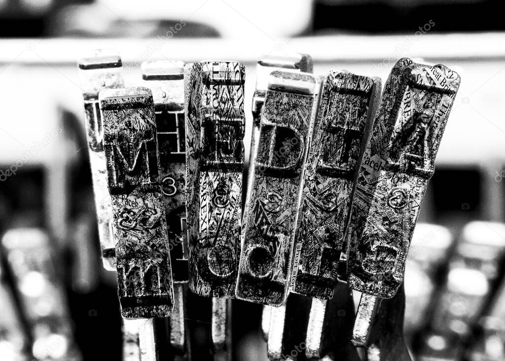 the word MEDIA with old typewriter hammers  in monochrome
