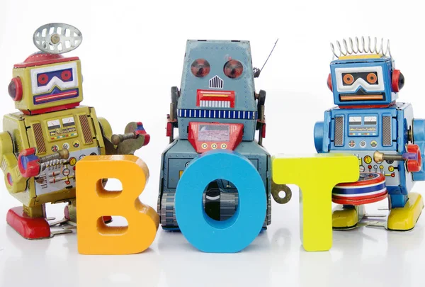 Drei Roboter Und Das Wort Bot — Stockfoto