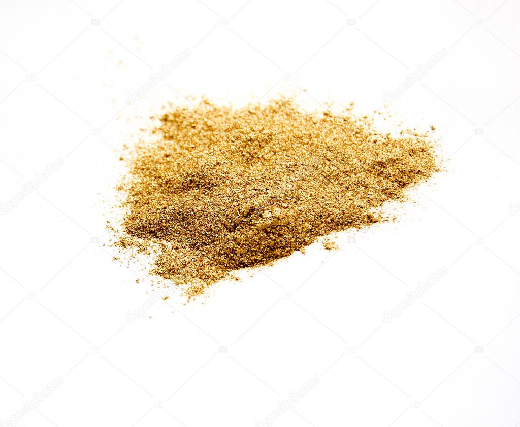 gold colored dust on white, wealth and luxury concept,image of a