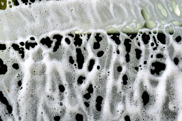 car wash foam patterns on a car window