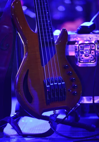 electric bas guitar on a stand in rock concert,image