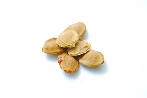 Apricot kernels on white background — Stock Photo, Image