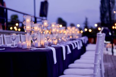 dinner table at a wedding by night image clipart