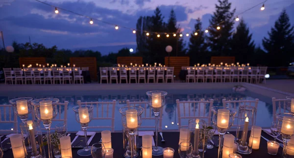 dinner table at a wedding by night image