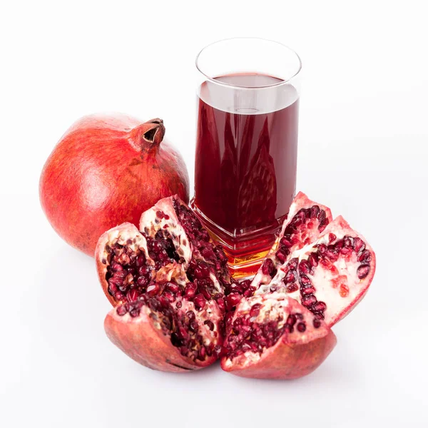 Pomegranate juice with pomegranate isolated on a white backgroun Stock Image