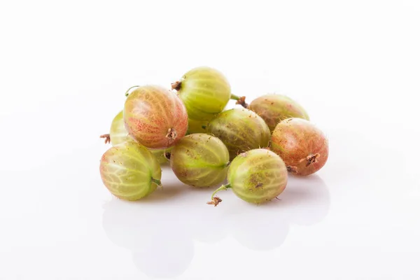 Heap of green gooseberries isolated on white background Royalty Free Stock Photos