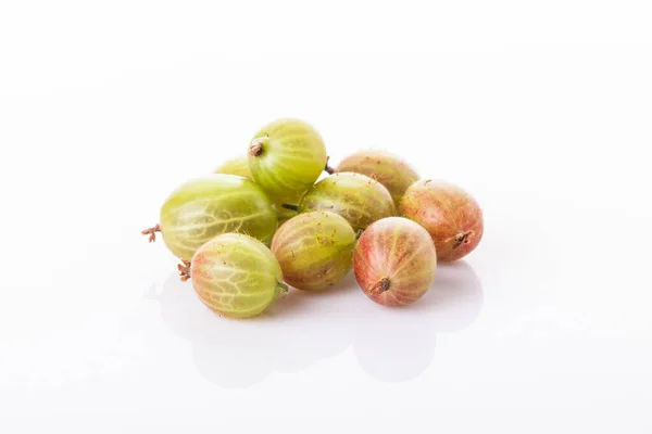 Heap of green gooseberries isolated on white background — Stock Photo, Image