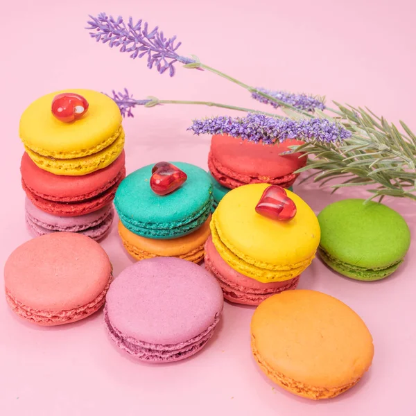 Tasty colorful macarons on pink background — Stock Photo, Image