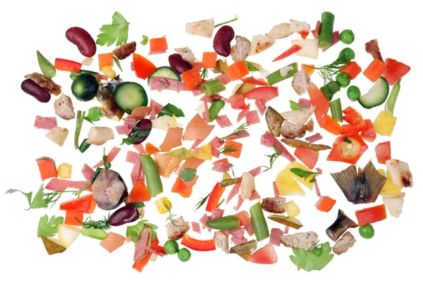 Small micro pieces of food waste are scattered on a white kitchen table concept. Isolated on white macro studio shot