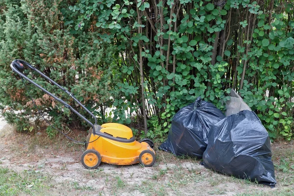 Garbage Dump Woods Village Broken Lawn Mower Black Plastic Bags — Stock Photo, Image