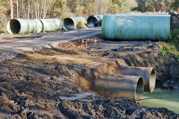 Large Sewer Pipes Lie Sand Dirt Autumn Forest Construction Site — Stock Photo, Image