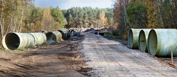 Large Sewer Pipes Lie Sand Dirt Autumn Forest Construction Site — Stock Photo, Image