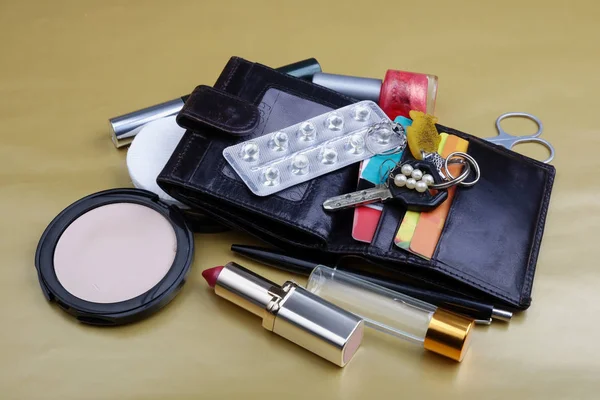 The contents of the ladies handbag  of an elderly woman