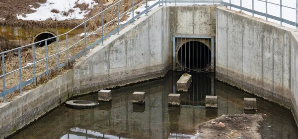 Dirty waste water merges from rural concrete sewage — Stock Photo, Image