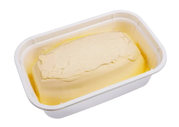 Margarina cremosa in un contenitore di plastica industriale isolato — Foto Stock