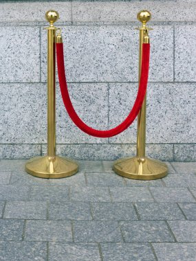 Thick velvet red rope and bronze racks for events fencing clipart
