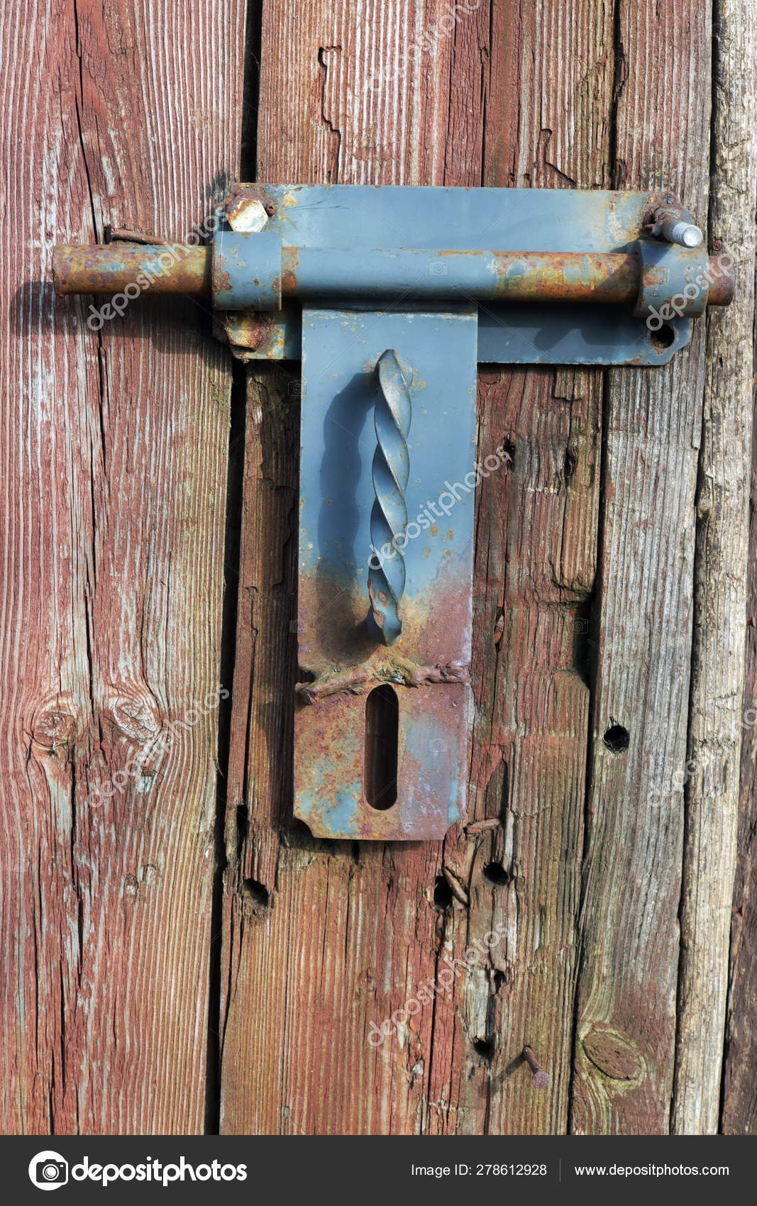 Rusty Rural Handmade Lock On Aged Wooden Shed Door Stock Photo