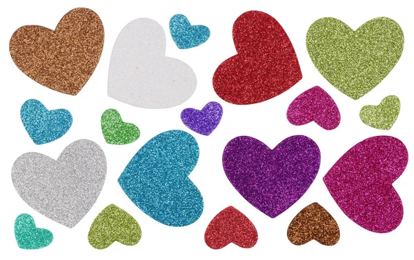 A handmade small multi-colored  paper hearts  is strewn with spa — Stock Photo, Image