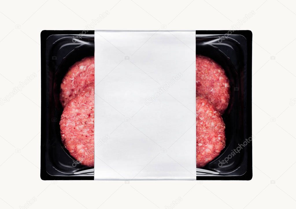 Raw fresh beef burgers in plastic tray on white background with silver label