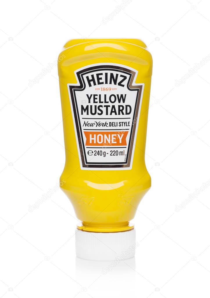 LONDON, UK - JUNE 01, 2018: A plastic bottle container of Heinz yellow mustard on white background.