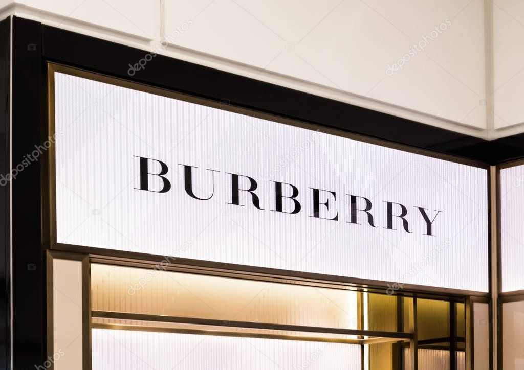 AMSTERDAM, NETHERLANDS - JULY 18, 2018: Burberry light billboard in shopping centre. in duty free shop.