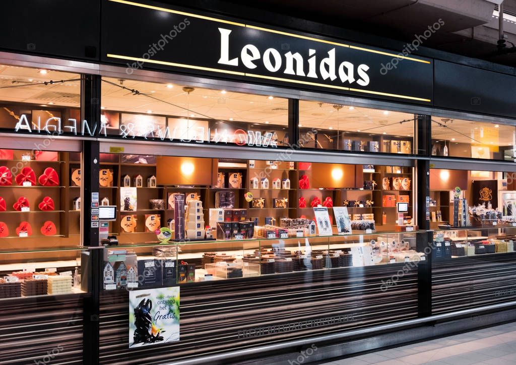 AMSTERDAM, NETHERLANDS - JULY 18, 2018: Leonidas Chocolate store at Schiphol Plaza, shop exterior with logo.