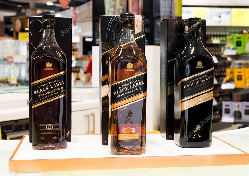 AMSTERDAM, NETHERLANDS - JULY 18, 2018:Johnnie Walker whiskey in Duty free shop at Airport. Black label.