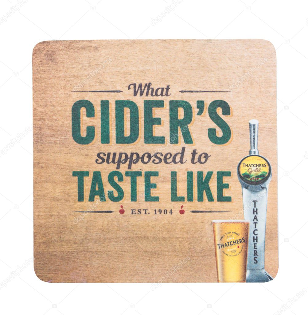 LONDON, UK - AUGUST 22, 2018: Thatchers Gold Cider original paper mat coaster isolated on white background.