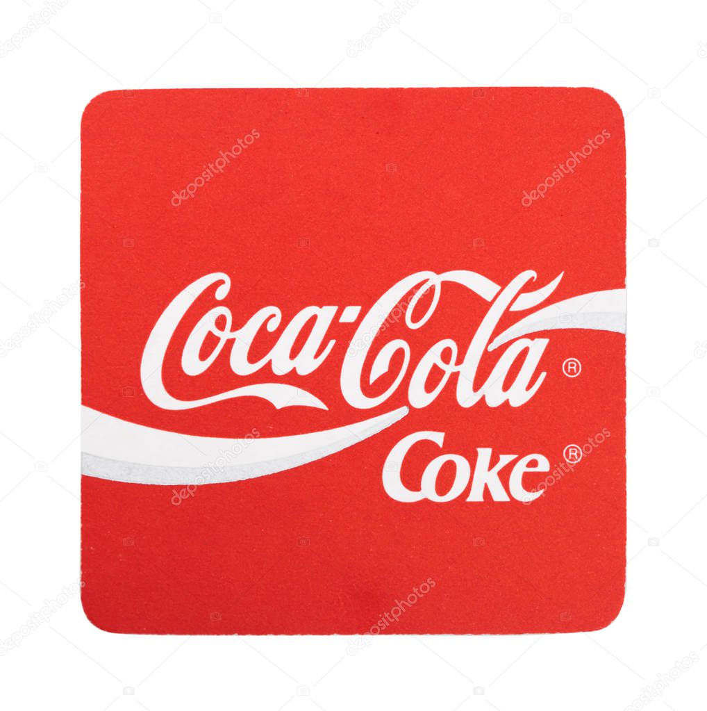 LONDON, UK - AUGUST 22, 2018: Coca Cola soft drink paper coaster on white background.
