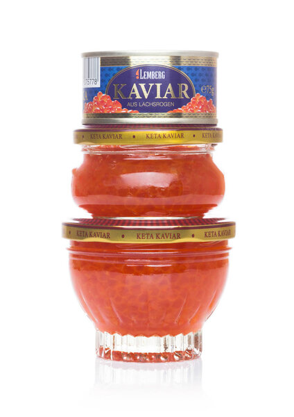 LONDON, UK - SEPTEMBER 03, 2018: Glass and steel containers with Lemberg red caviar on white background.