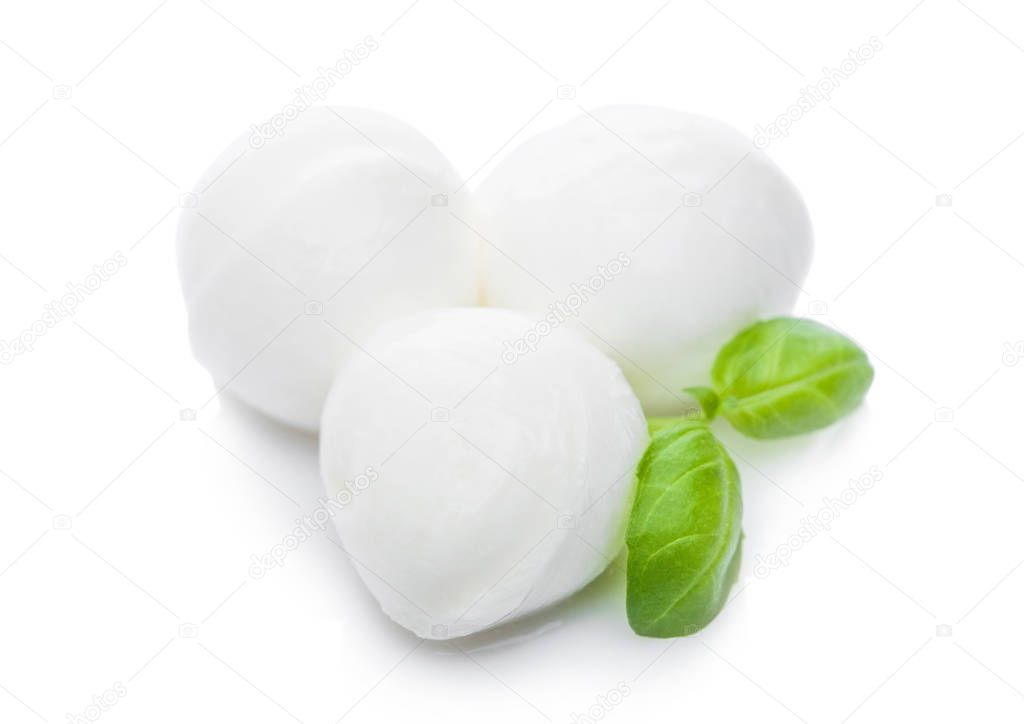 Fresh Mozzarella cheese and basil leaf on white background with reflection