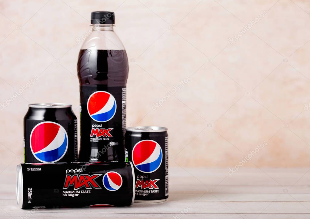 LONDON, UK - AUGUST 03, 2018: Plastic bottle and aluminium cans of Pepsi Max soft drink on wood.American multinational food and beverage company