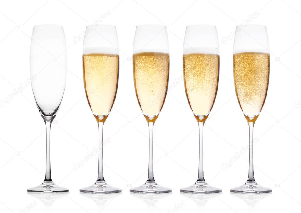 Elegant glasses of yellow champagne with bubbles