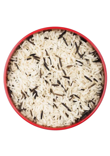 Red bowl of raw organic basmati long grain and wild rice on white background. Healthy food. — Stock Photo, Image
