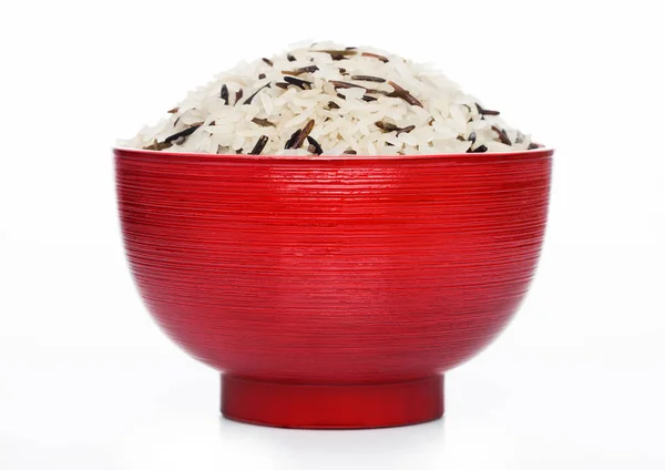 Red bowl of raw organic basmati long grain and wild rice on white background. Healthy food. — Stock Photo, Image