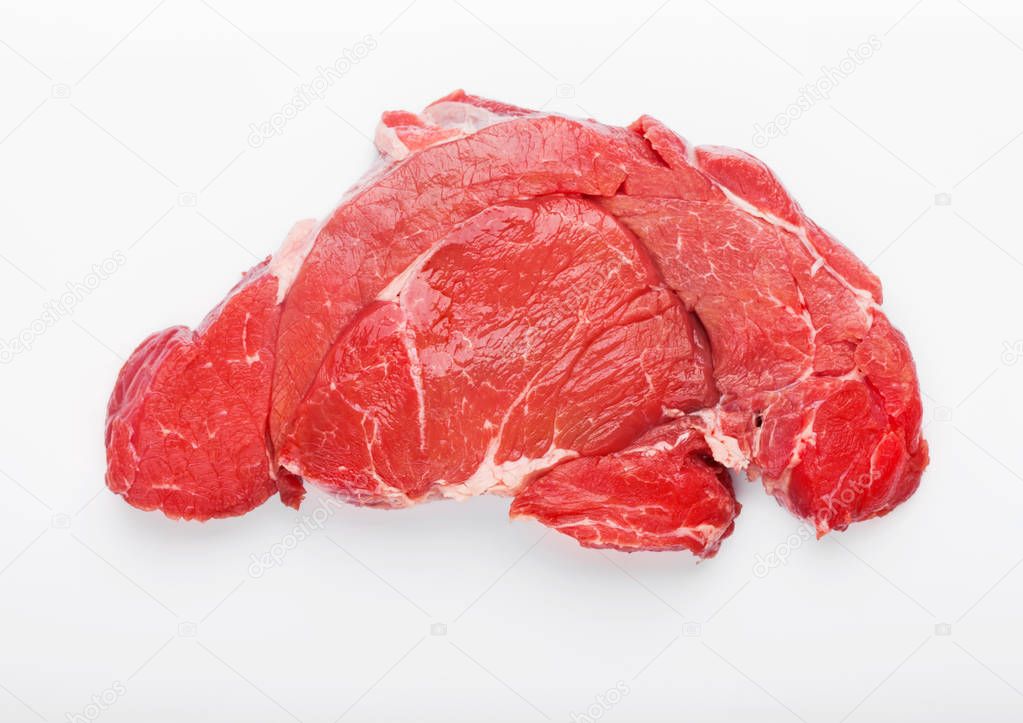 Fresh raw organic slice of braising steak fillet on white background.
