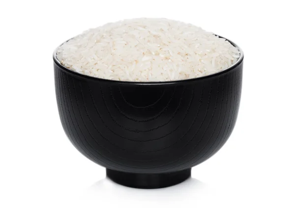 Black bowl of raw organic basmati rice on white background. Healthy food. — Stock Photo, Image