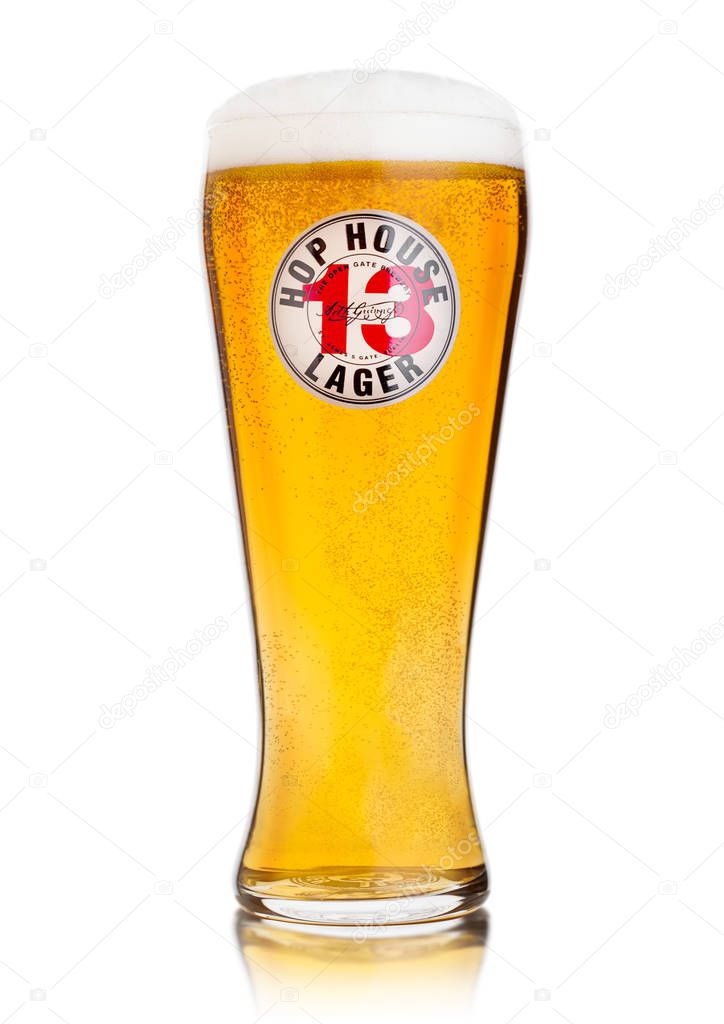 LONDON, UK - OCTOBER 10, 2019: Cold glass of Hop House 13 lager beer on white.